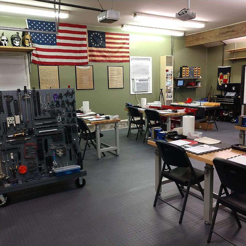 A room full of tools and flags in a workshop.