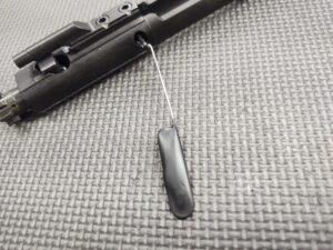 A SOTAR TFPRPRT - MK2 "Tactical Firing Pin Retaining Pin Removal Tool" with a clip attached to it.