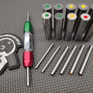 A SOTAR BCG 3 Bore & Gas System Gauge Set of metal rods and a set of colored pins.