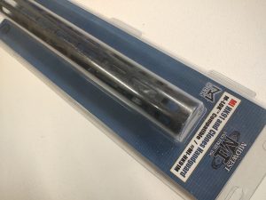 A packaged HK91 AND CLONES HANDGUARD M-LOK is seen in a sealed plastic cover with a blue background. The text on the packaging highlights features such as length and construction material.