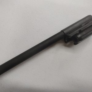 An HK PSG1 Trigger with HK91 Trigger Housing, featuring a long cylindrical rod and a clamped attachment on one end, placed on a white surface.