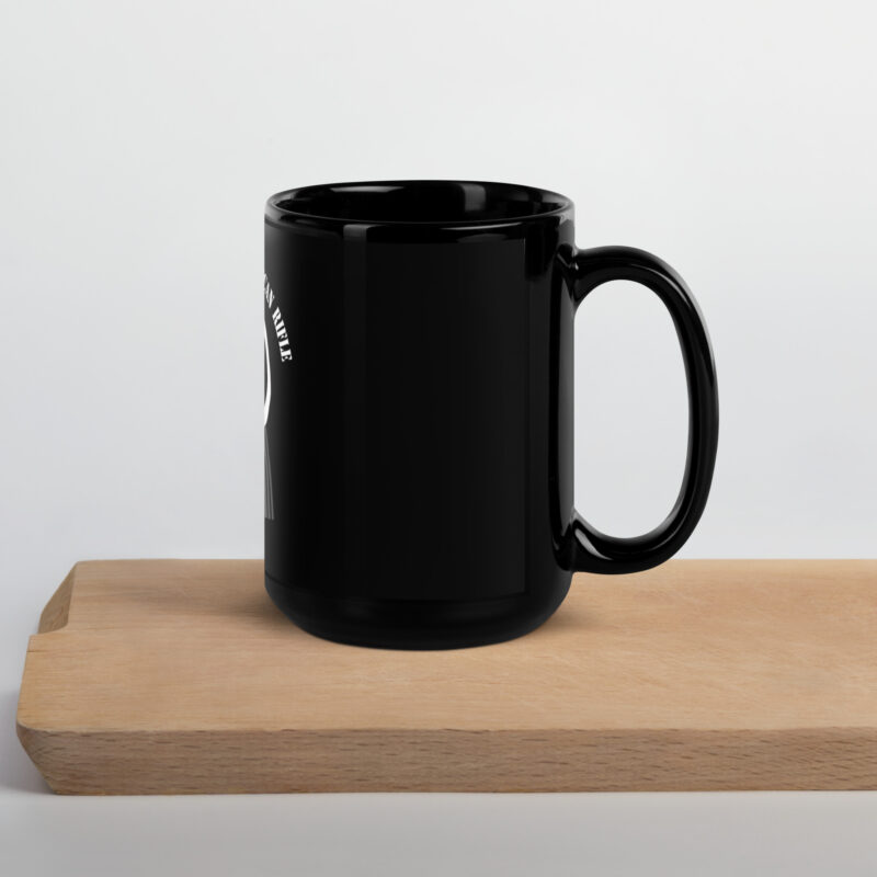 A SOTAR Black Glossy Mug on a wooden cutting board.