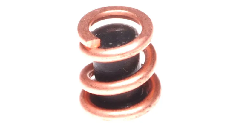 A copper coil spring on a white background.