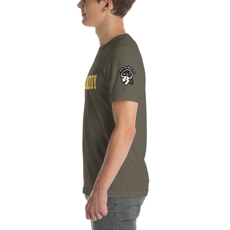 A man wearing a green SOTAR Gauge Daddy t-shirt with a yellow logo on it.